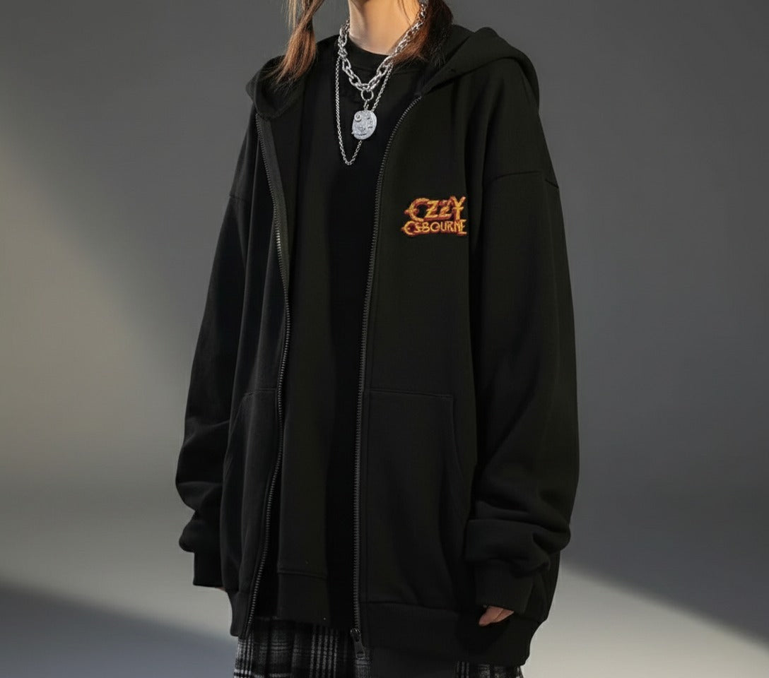 Person wearing a black hoodie with 'Ozzy Osbourne' logo on a gray background